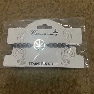 Stainless steel, black pullstring bracelet with silver setting